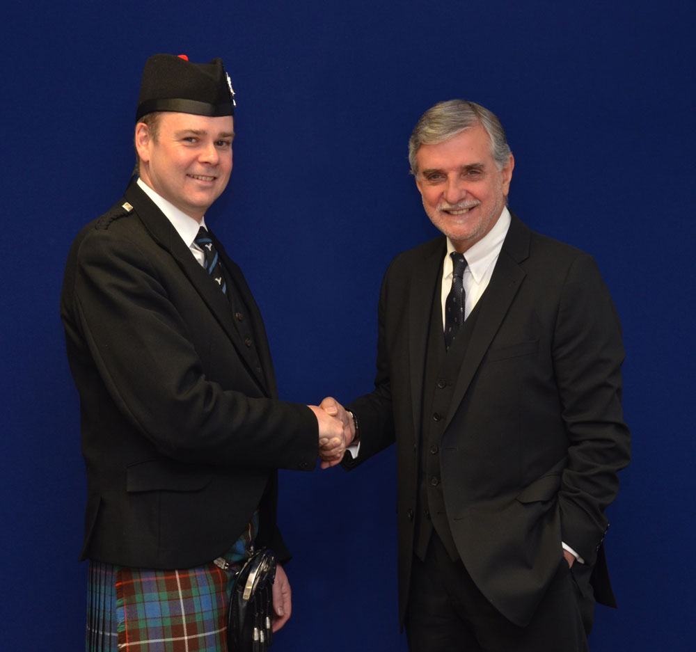 Pipe-Major Ross Walker and People Ford Chairman and Managing Director Brian Gilda shake on the two-year sponsorship deal of the Boghall & Bathgate Caledonia Pipe Band.