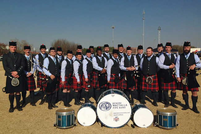 Benoni MacTalla in a celebratory mood after winning the 2014 South African Pipe Band Champions title.