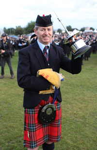 Field Marshal Montgomery Pipe-Major Richard Parkes with his fourth consecutive World's trophy and tenth overall.