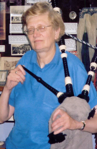 Jeannie Campbell receives MBE for Services to Piping pipes drums