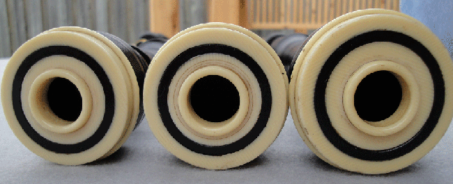 Celluloid is a brilliant ivory substitute, fooling many because of the ivory-like cross-hatching. However, the grain is straight and parallel, unlike ivory cross-hatching, which is curved with intersecting concentric lines.