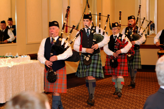 Jim McGillivray leads the Guelph reunion band out of the hall.