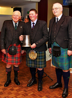Judge Ian McLellan, Douglas Murray and City of Edinburgh Pipe Band Pipe-Major Barry Donaldson at the 2016 Pipe-Majors' Wheel of Fortune competition.