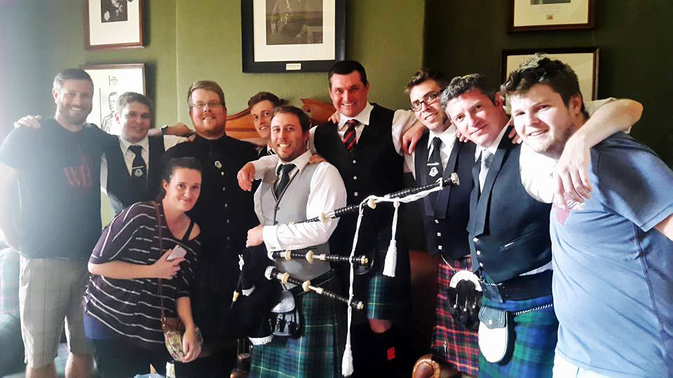 Amateur overall winner Craig Paxman and friends celebrate his success and new set of pipes.