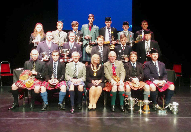 Northern Meeting 2016 prize winners. Front L-R: Iain Speirs, Finlay Johnston, Northern Meeting piping convenor Alan Forbes, the Lord Provost of Inverness, unknown, Angus J. MacColl and Ian K. MacDonald. Middle row L-R: Sean McKeown, Callum Beaumont, Connor Sinclair and Ben Duncan.