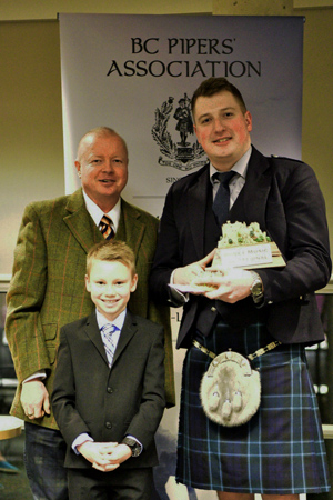 Andrew Lee (right), winner of the 2017 Boney Music Invitational, with Andrew Bonar and Bonar's son, Cameron.