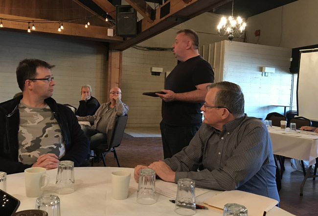 John Cairns leads discussion in one section of the 2017 PPBSO Judges Seminar as (L-R) adjudicators Dan Bist, Hugh Cameron, Jim McGillivray and Charlie MacDonald listen.