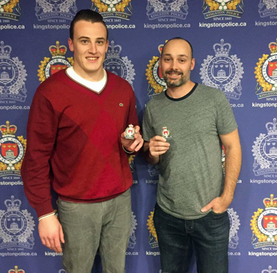 John McKay and Scott Nicholson present Kingston Police credentials.