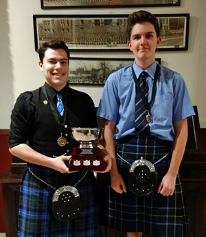 Colin Johnstone (right) and Mark McClennan with the Geoff Neigh Memorial Trophy for 6/8 marches.