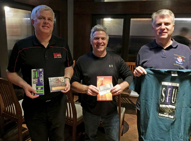 Then Pipe-Major Terry Lee, Lead-Drummer Reid Maxwell, and Pipe-Sergeant Jack Lee with the brochure, CD, Stagebill program, concert ticket, and T-shirt from the 1998 Carnegie Hall concert.