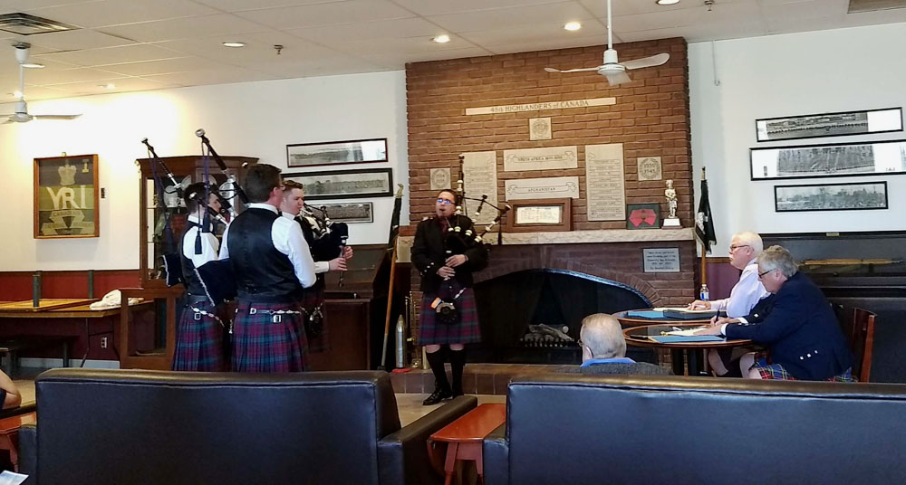 The Alma College quartet competes for judges Ken Eller and Peter Sinclair.