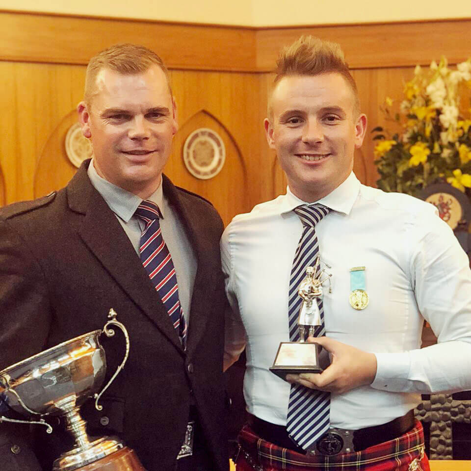 Stuart Easton and Liam Kernaghan with their awards at the annual New Zealand Open Solo Piping Championships at Hastings.
