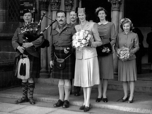 The post-war wedding of George McLennan and Jessie Watt. The piper is Pipe-Major Cherry Anderson.