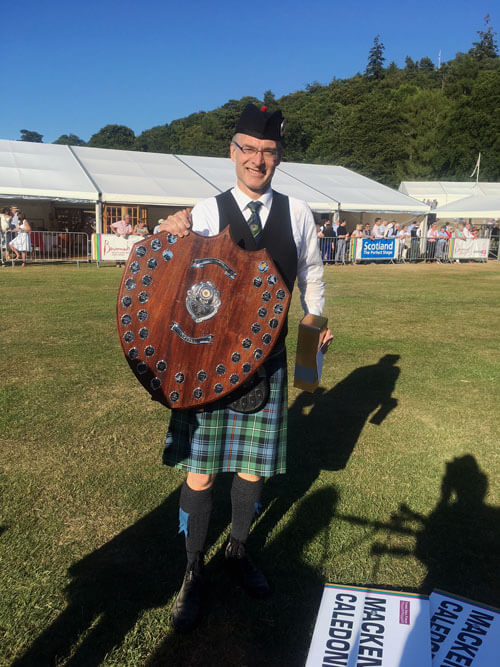 MacKenzie Caledonian Pipe-Major Neil Nicholson with the Grade 2 trophy from the 2018 European Championships.