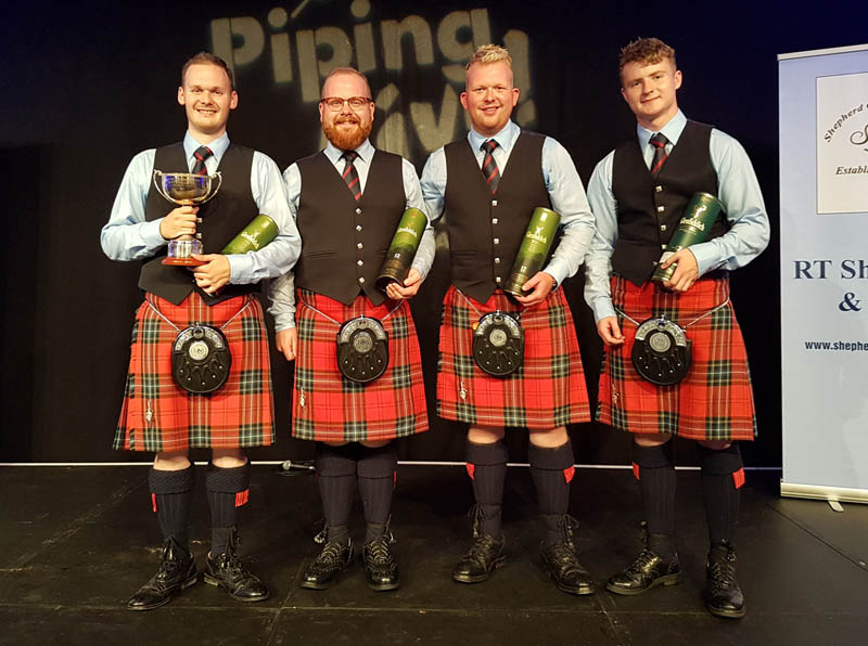 The winning FMM quartet, with Graham Drummond holding the cup.