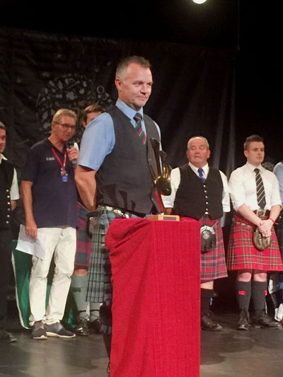 Stuart Liddell accepting the MacCrimmon Trophy at Lorient.