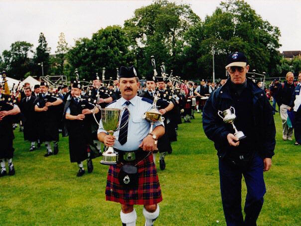 The Victoria Police Pipe Band marches off with the World Championship, Glasgow Green, August 15, 1998. It would be the final competition outside of Scotland for the band.