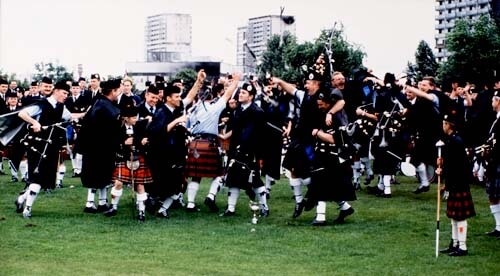 Victoria Police Pipe Band celebrate the announcement of their 1998 World Championship victory at Glasgow Green.