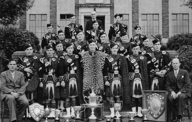 The Bowhill Colliery Pipe Band, c.1947. Pipe-Major Chris Sutherland is second from the far left. Next to Sutherland is the band's famous lead-drummer, Gordon Jelly.