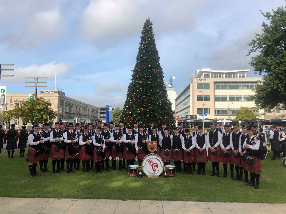 Canterbury Caledonian gather under the Christmas Tree at Palmerston North after winning the 2018 Square Day Pipe Band Championship.