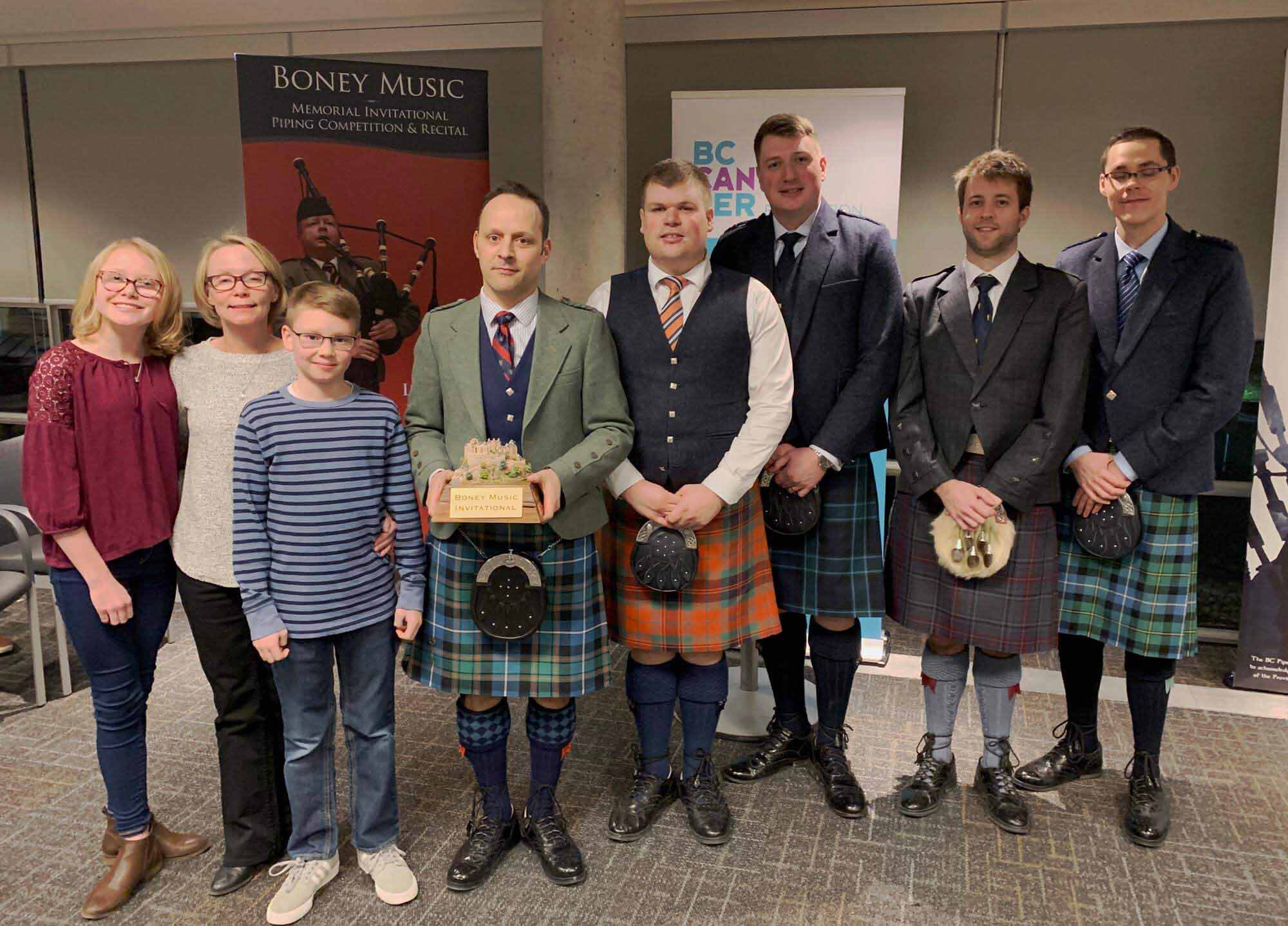 At the fourth annual Boney Music Memorial Invitational Piping Competition & Recital (L-R): Kate Bonar, Jeanette Bonar, Cameron Bonar, Jori Chisholm, John Lee, Andrew Lee, Alastair Lee and Zephan Knichel.
