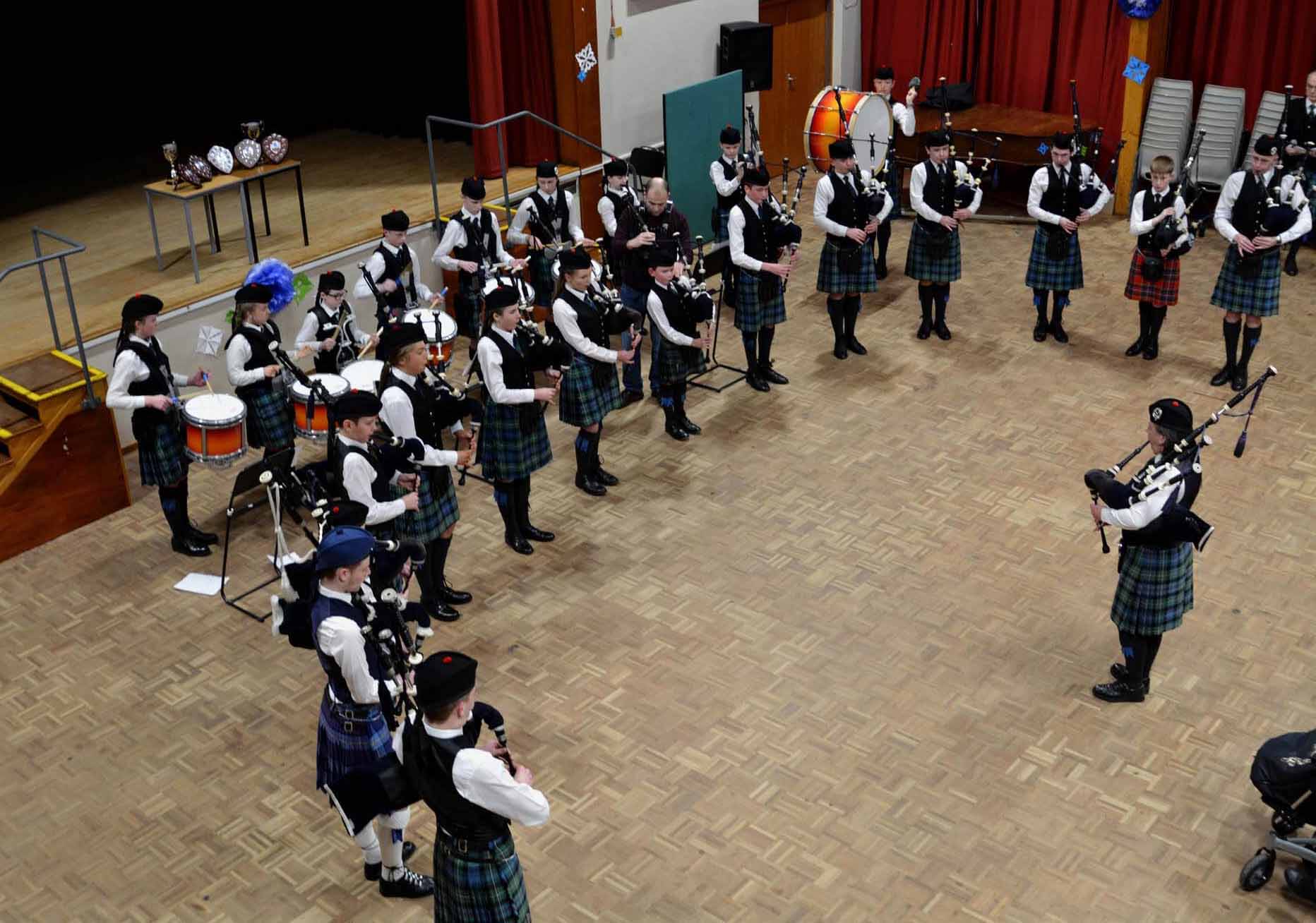 The MacKenzie Caledonian Novice band -- the "Mini-Macs" -- in concert one last time with Pipe-Major Anne Spalding at Craigie High School.