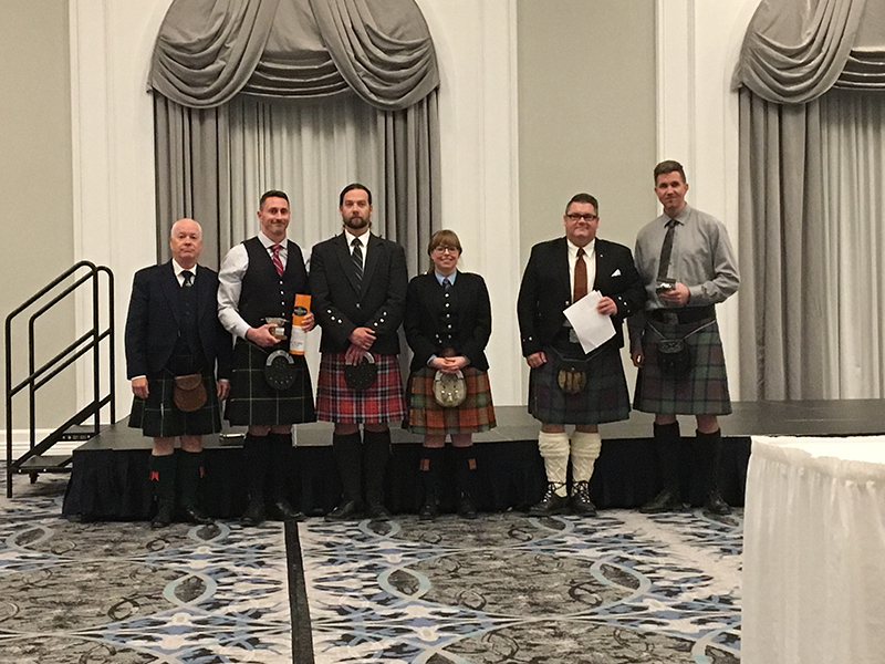 Judge and competitors at the 2019 Prairie Piping Invitational.