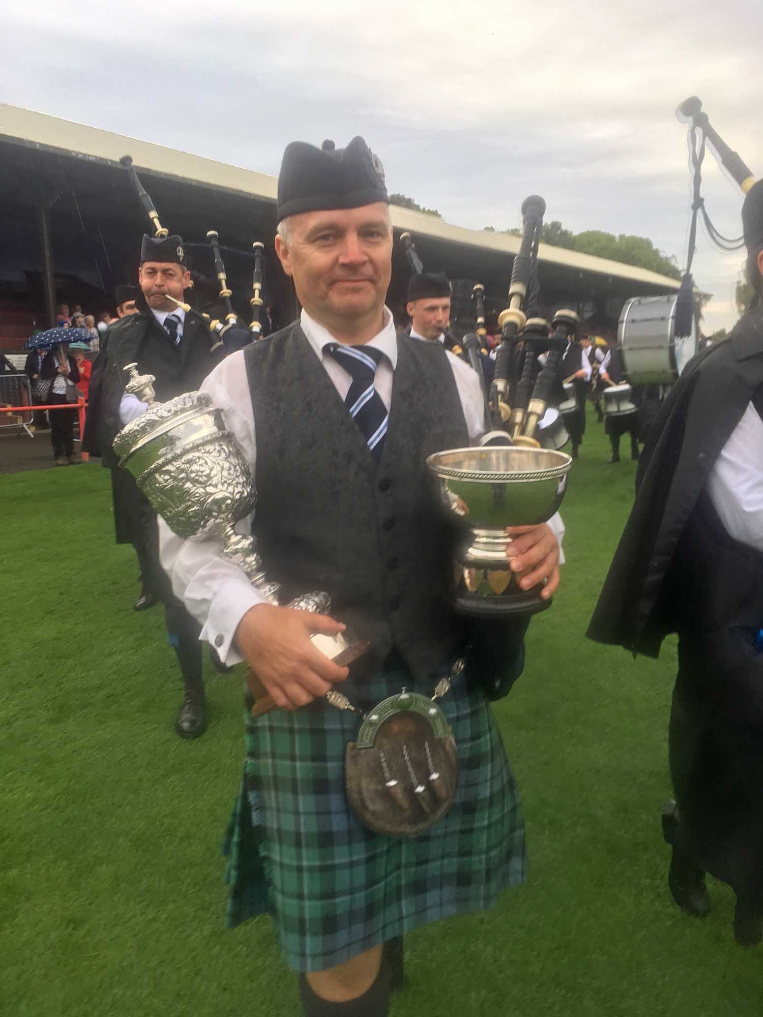 Inveraray & District Pipe-Major Stuart Liddell with the 2019 European Championship trophies.