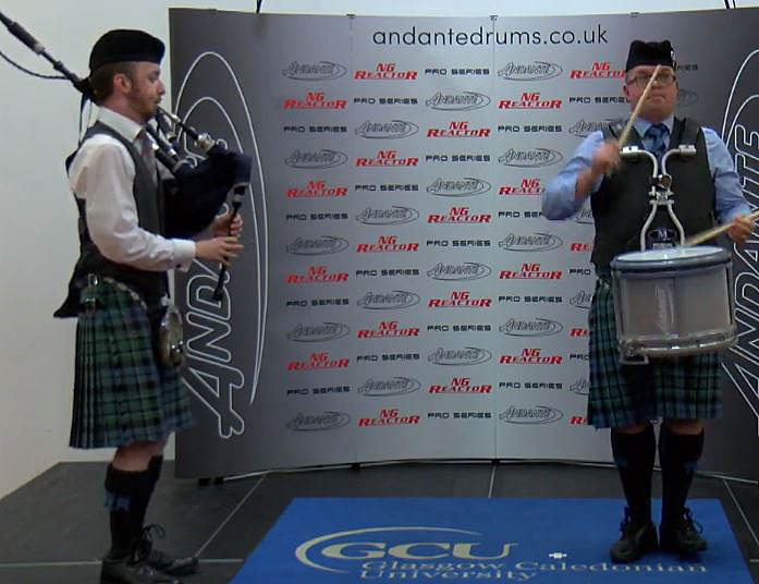2019 World Solo Drumming Champion Steven McWhirter with Inveraray & District piper Daniel McDermott.