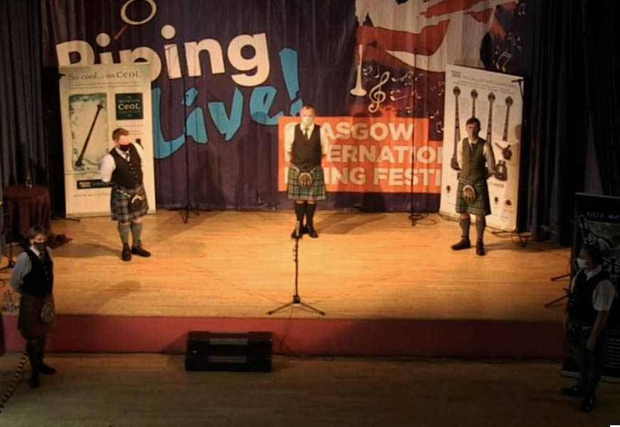 The five competitors at the end wearing face masks.