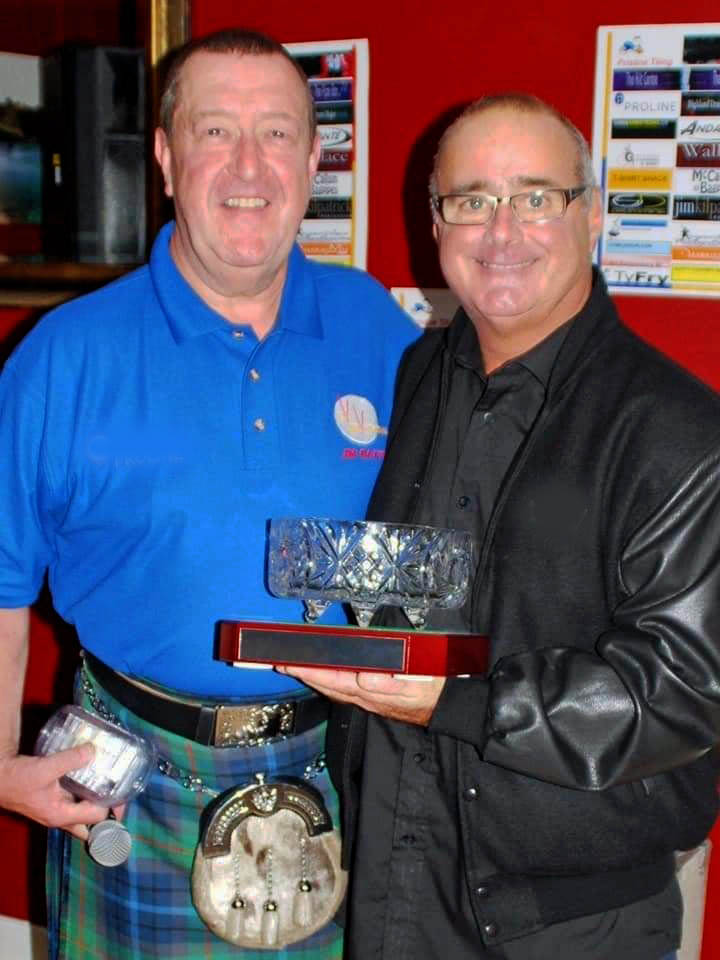 Organizer Jim Baxter (left) presents the 2014 Liv INNvitational trophy to Jim Kilpatrick.
