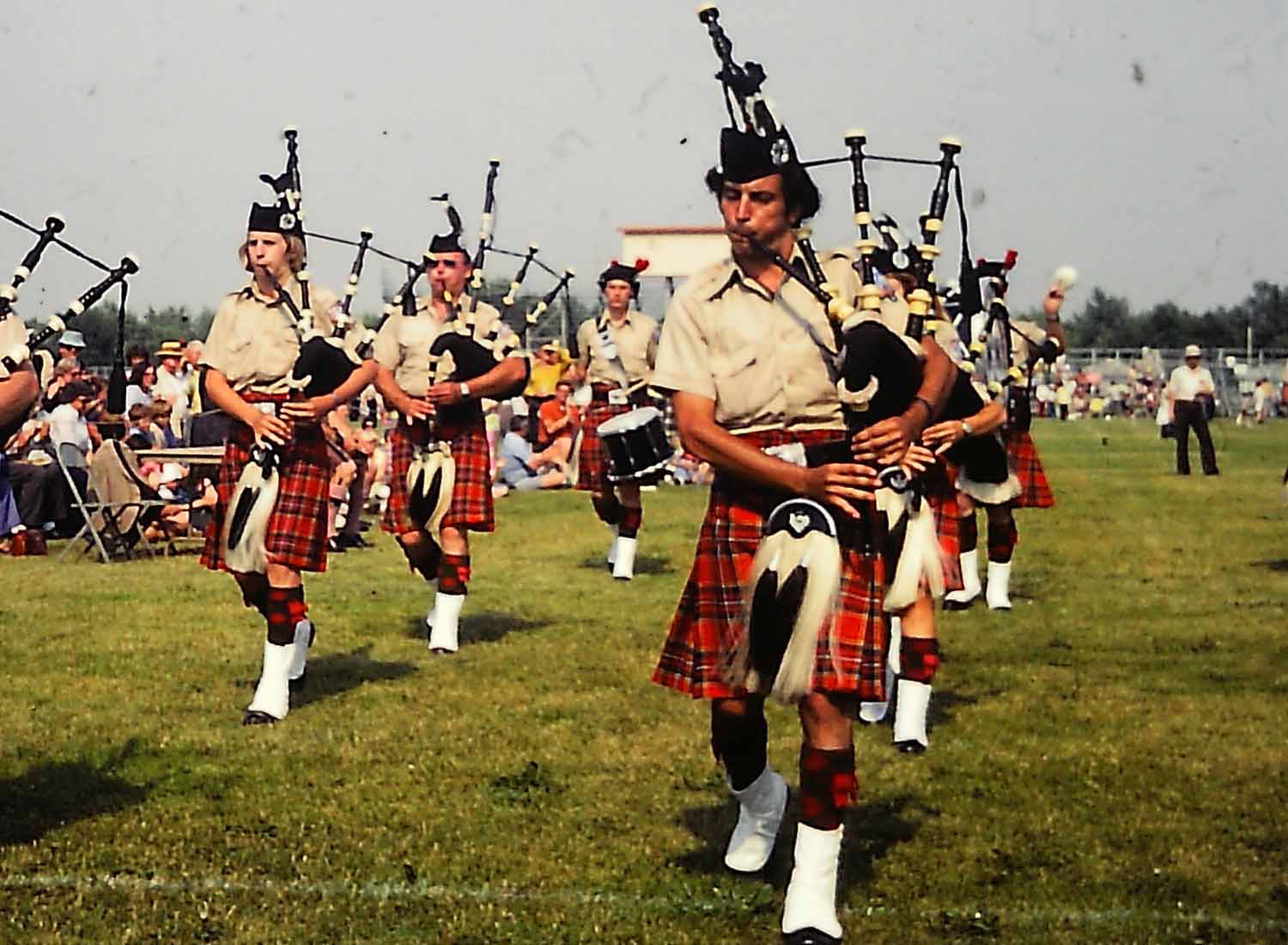 The Meeting of the Waters Pipe Band at the 1977 Midlothian Highland Games near Chicago. L-R: 13-year-old Andrew Berthoff, V. Victor Masterson, L-D Charlie Cablish, and Ian Cohen, who still plays with the band, which evolved to be the current St. Louis Caledonian.