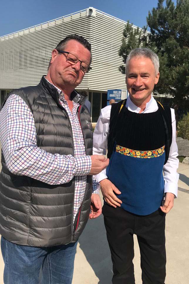 Iain MacInnes (right) in his Bagad Penhars uniform with Breton bombarde player Gilles Troel.