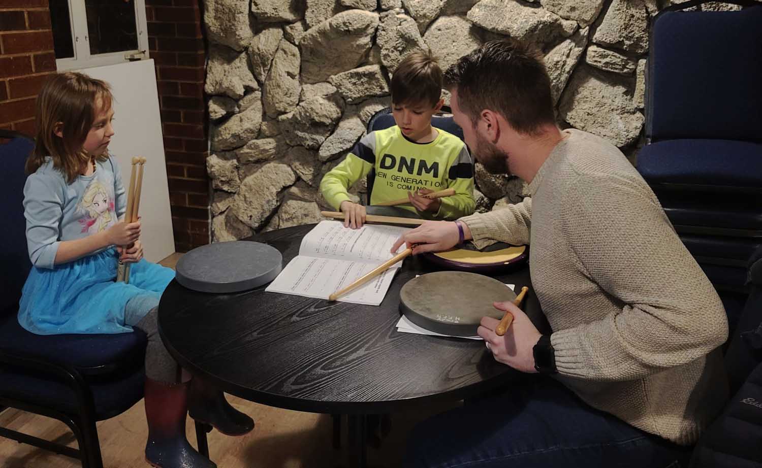 Novice pipe band drummers receive instruction through the Hamilton Police Pipe Band's efforts.