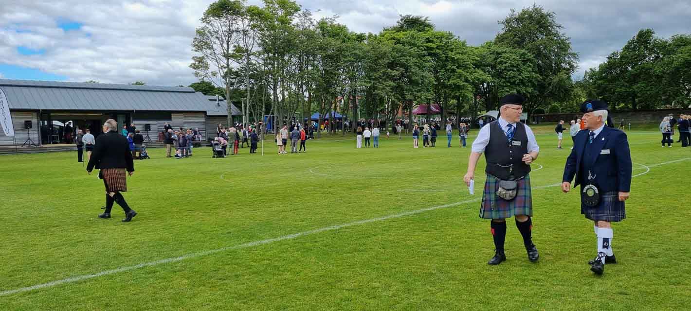 The pre-competition scene at the 2022 Edinburgh Pipe Band Championships.