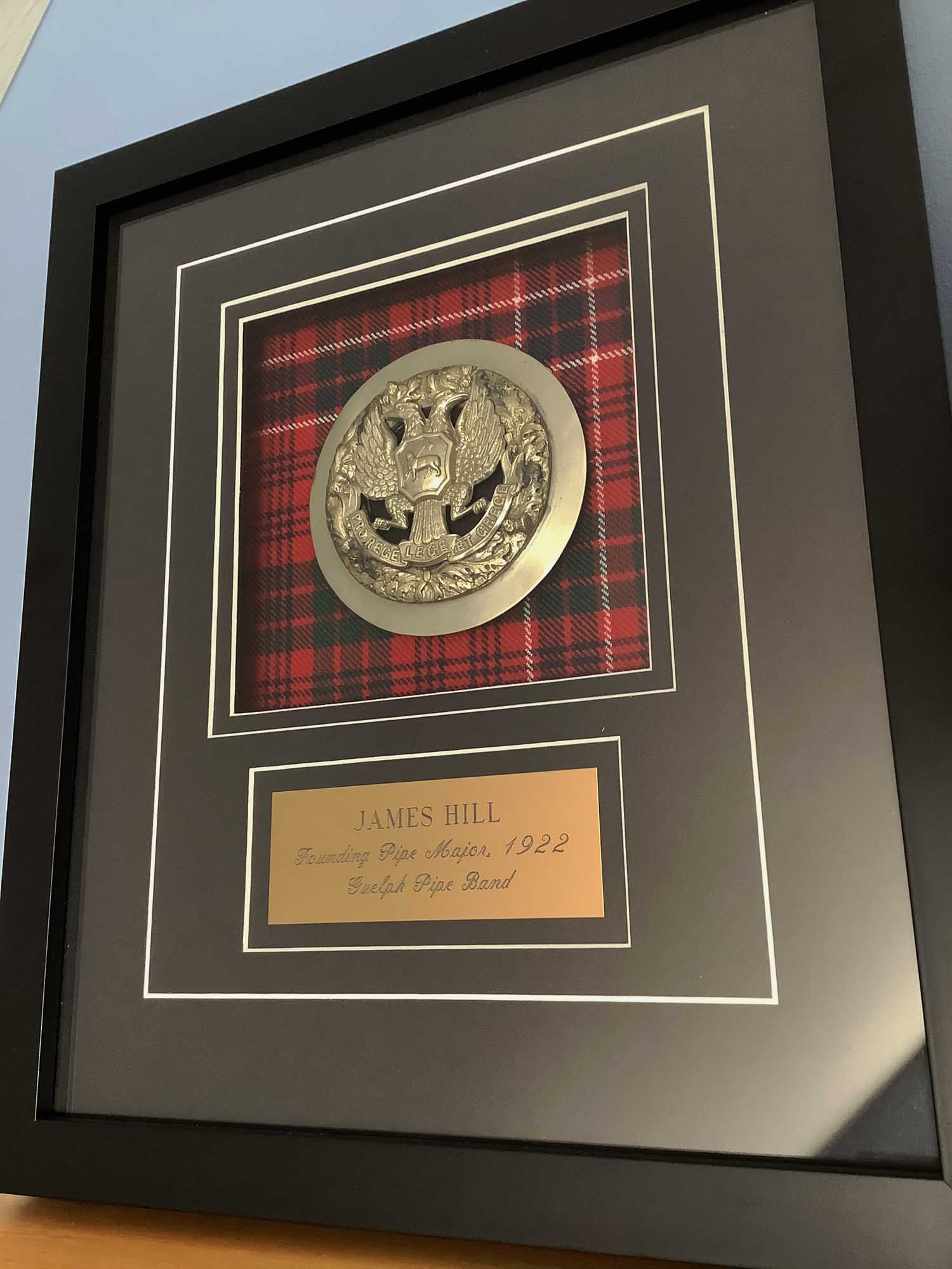 Founding Pipe-Major James Hill's plaid brooch.