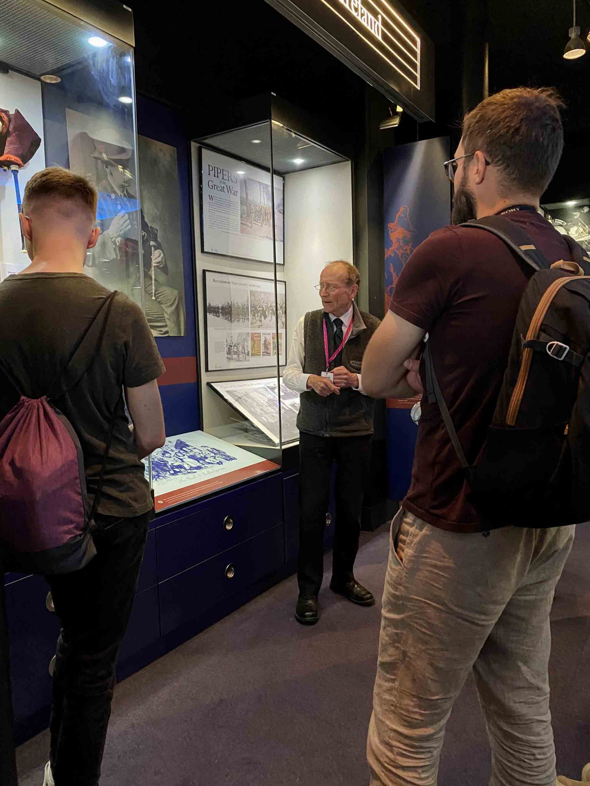 Hugh Cheape taking a rapt audience through the National Piping Centre's museum.