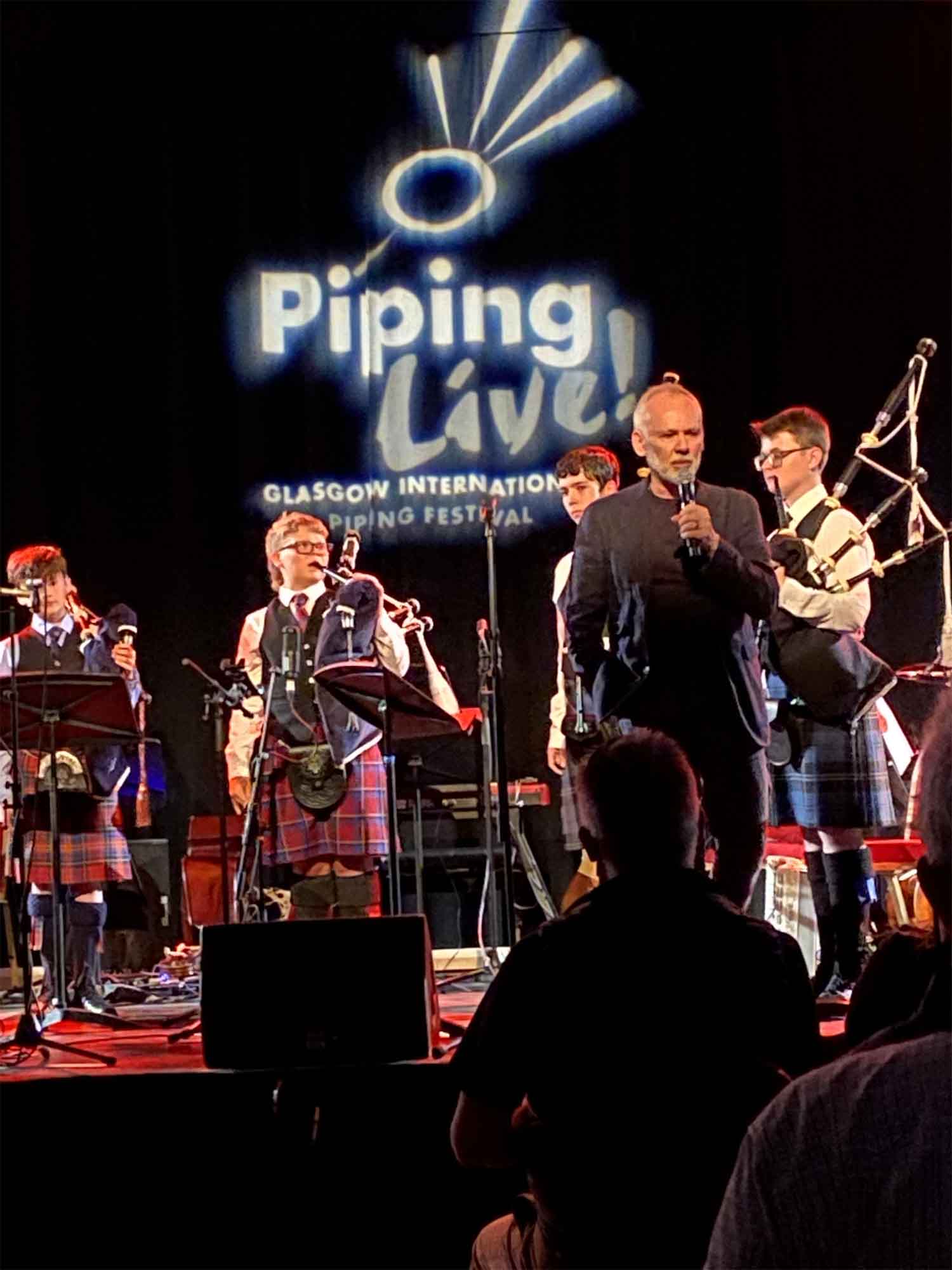 Host Fergus Muirhead introduces the National Youth Pipe Band of Scotland.
