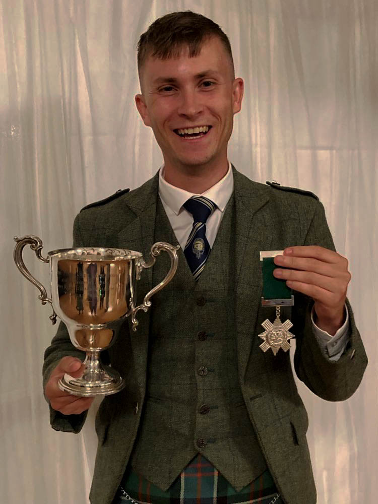 Connor Sinclair with his winnings from the Argyllshire Gathering Former Winners MSR.
