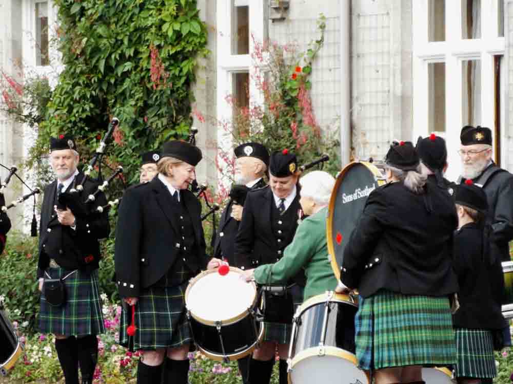 The Sons of Scotland Pipe Band meets with Queen Elizabeth II at a previous performance at Balmoral.