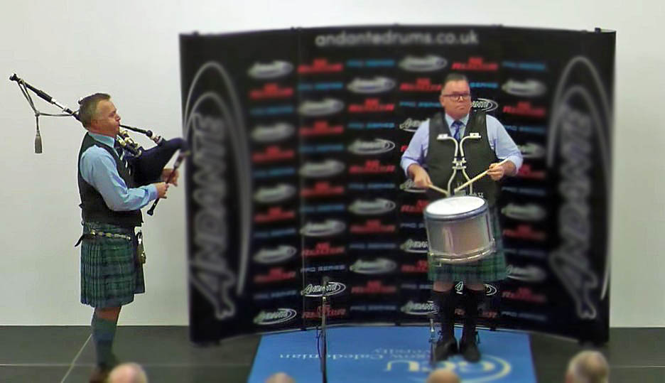Steven McWhirter on his way to winning his eleventh World Solo Pipe Band Drumming title, with his Inveraray & District pipe-major, Stuart Liddell, playing for him.