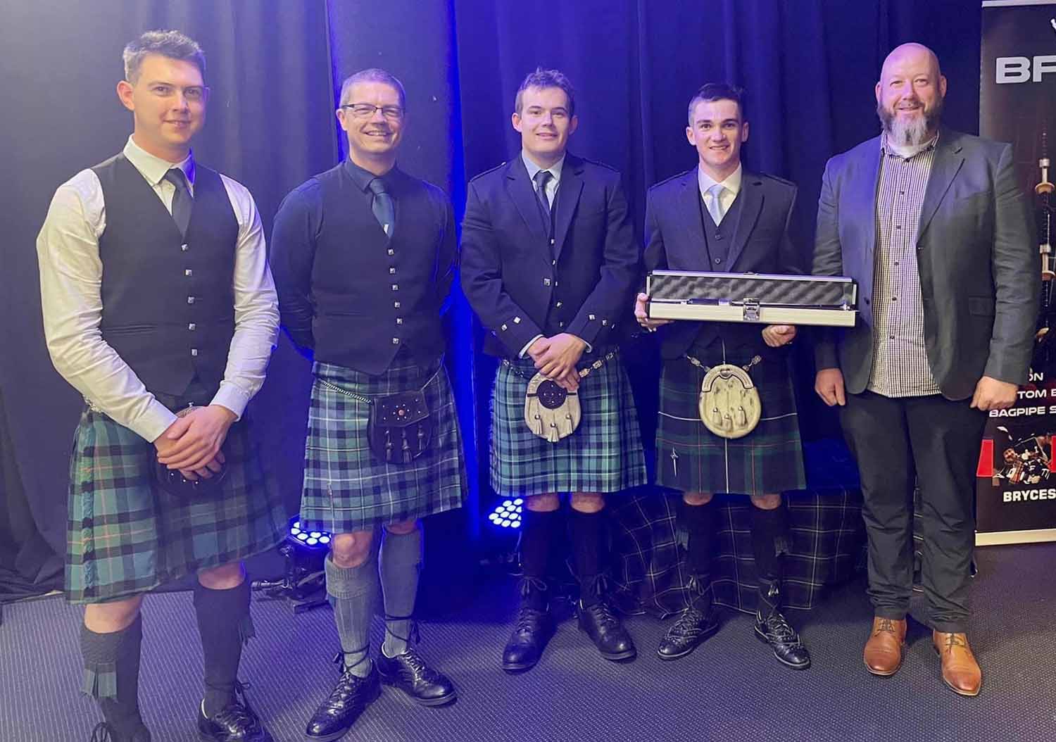 NZ Silver Chanter prize-winners (L-R): Piers Dover, Scott Armstrong, Logan Dale and Hamish Reade with sponsor Graeme Bryce.
