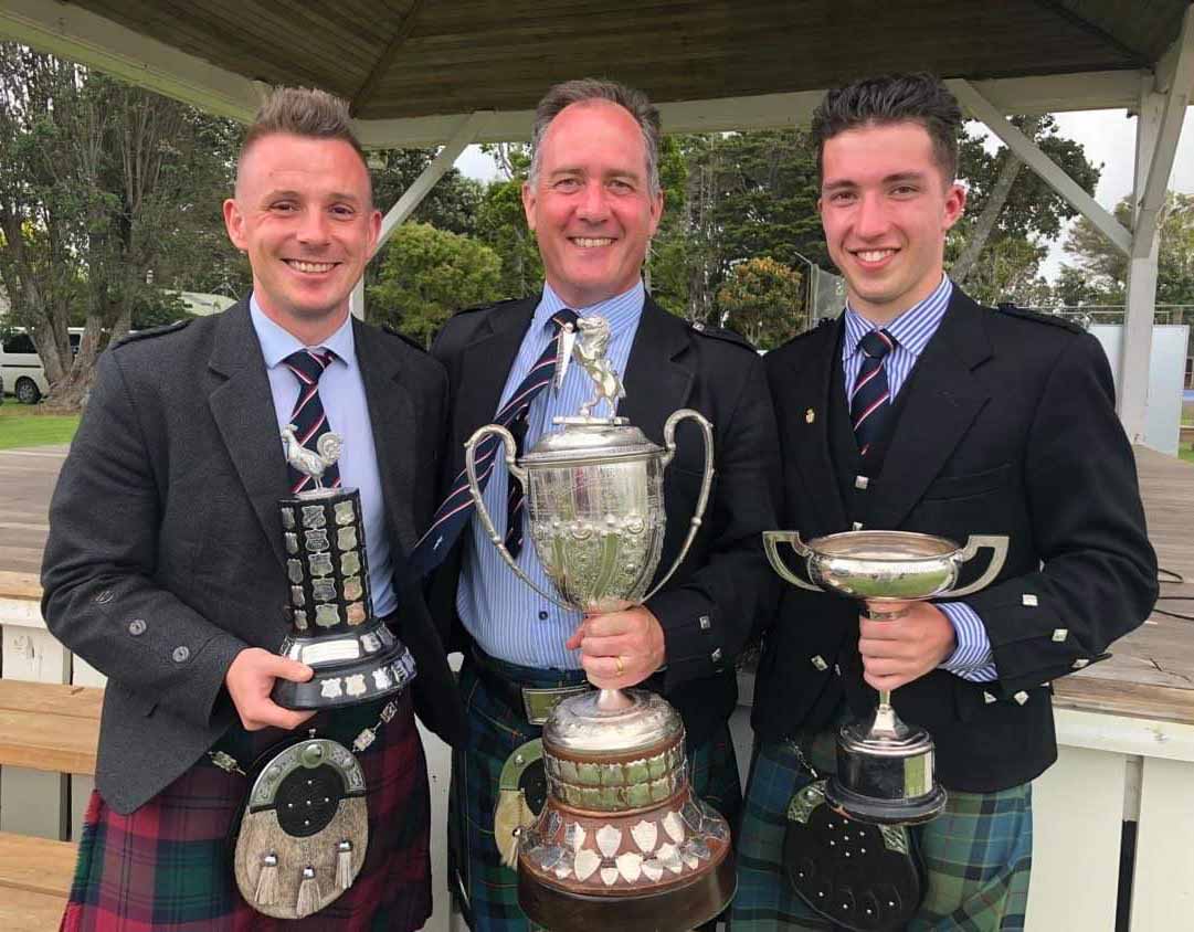 Liam Kernaghan, Greg Wilson and Campbell Wilson enjoy their trophies from the 2023 Waipu Highland Games.