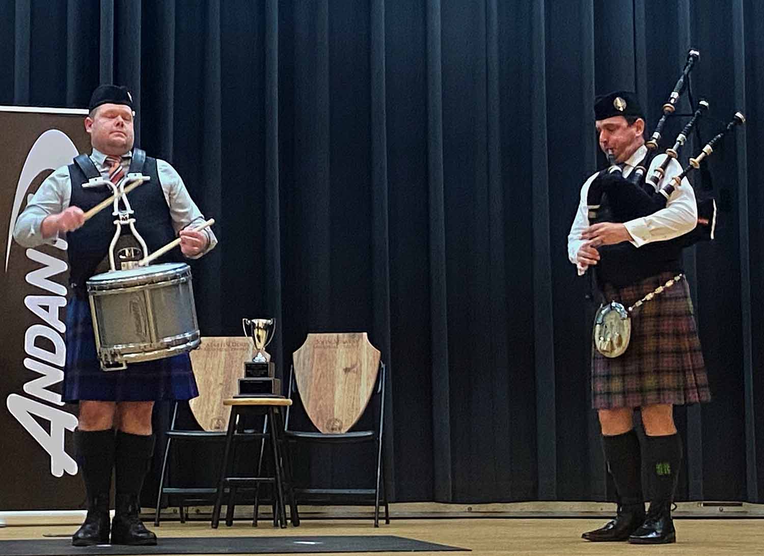 Derek Cooper competing with piper Andrew Carlisle accompanying.