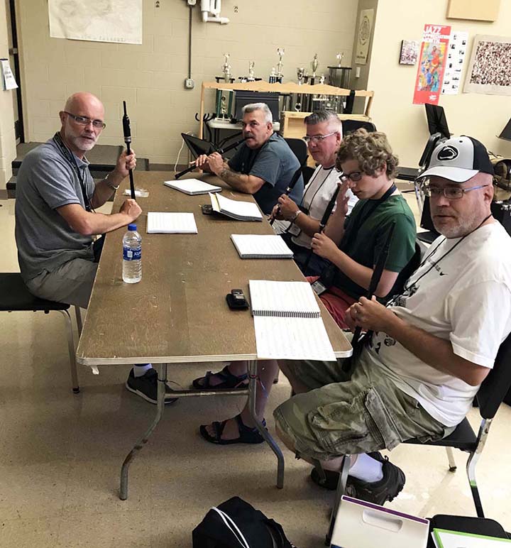 Terry Tully (left) teaches a small group at a 2022 Balmoral School.