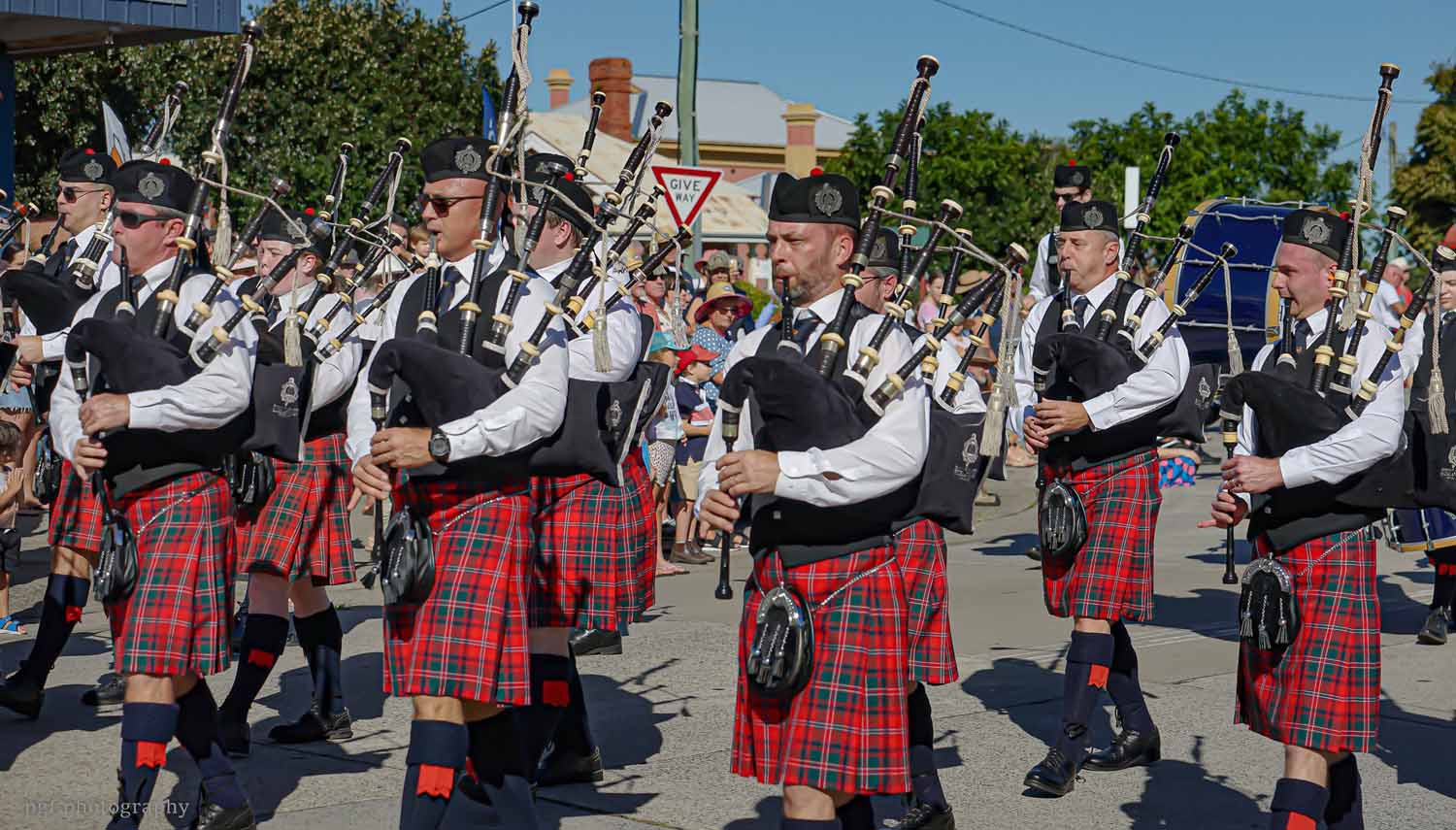 The Emmanuel College Highlanders at University of Queensland in the street march to the MacLean Highland Games.