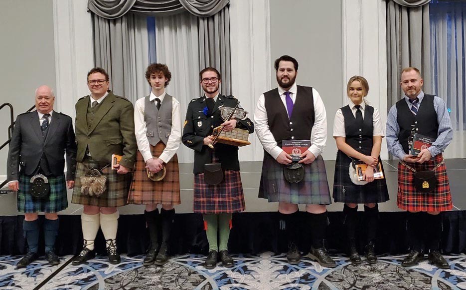 Judge Jim McGillivray (far left) and competitors at the 2023 Saskatchewan Highland Gathering & Celtic Festival Amateur Solo Piping Competition.