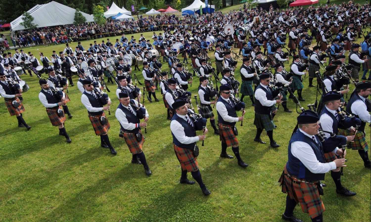 The massed bands at the 2023 BC Highland Games.