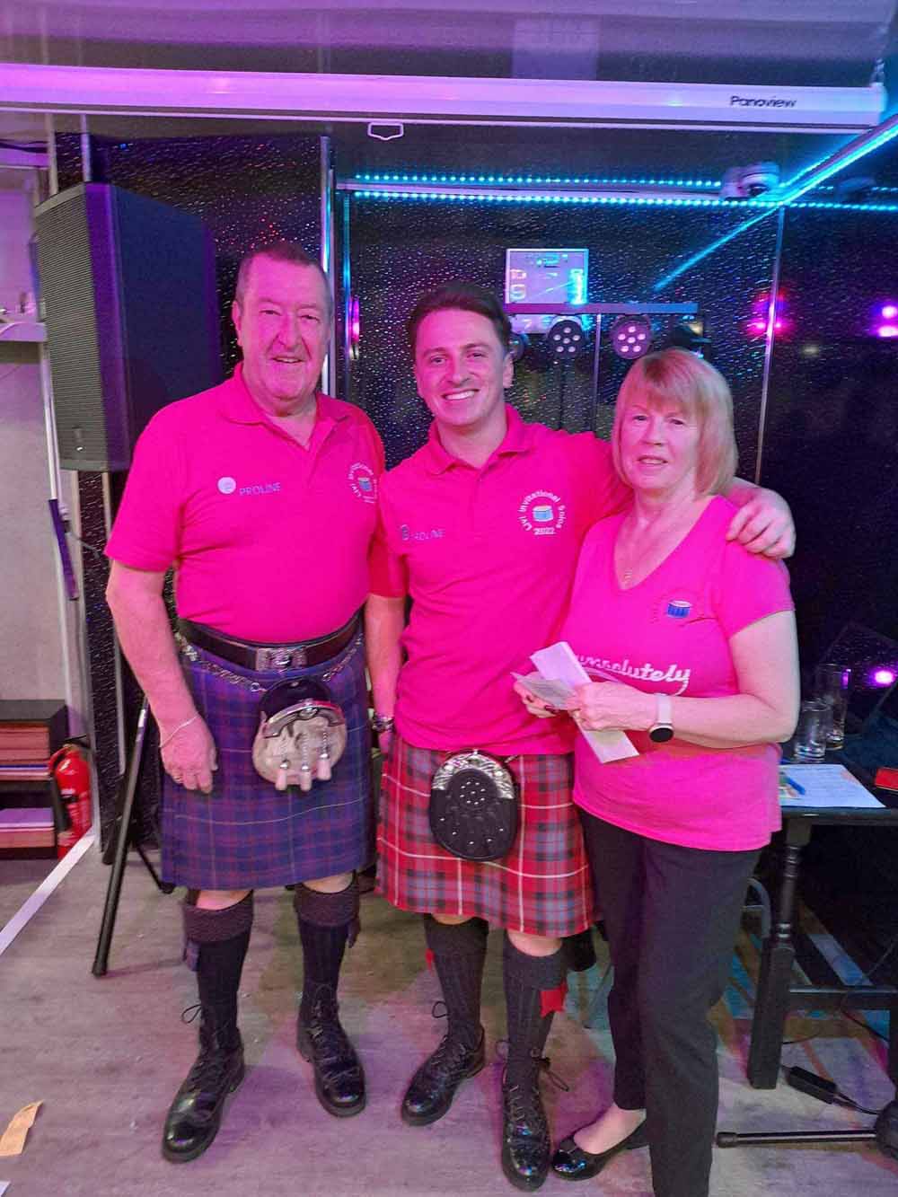 Organizers Jim and Cecelia Baxter with 2022 Livi Invitational Solo Drumming Competition winner Grant Cassidy (centre).