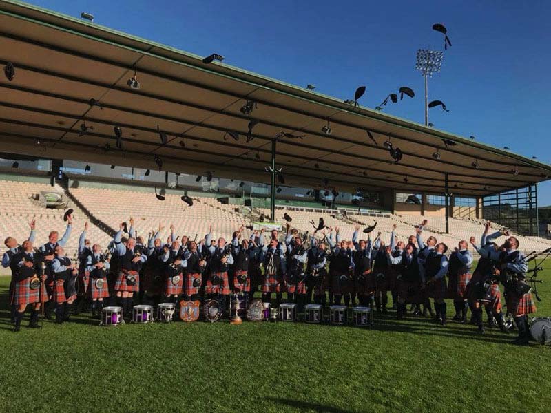 The New Zealand Police Pipe Band celebrates its 2018 New Zealand Pipe Band Championship victory under Pipe-Major Emmett Conway.